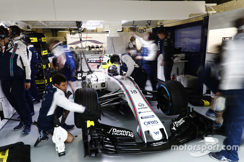 Lance Stroll, Williams FW40, in the Williams garage