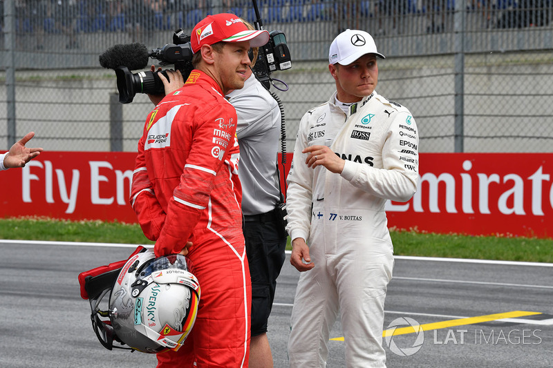 Sebastian Vettel, Ferrari and pole sitter Valtteri Bottas, Mercedes AMG F1