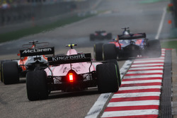 Fernando Alonso, McLaren MCL32, leads Esteban Ocon, Force India VJM10