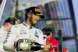 Lewis Hamilton, Mercedes AMG, 2nd Position, sprays Champagne from the podium