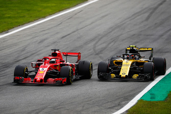 Sebastian Vettel, Ferrari SF71H, passes Carlos Sainz Jr., Renault Sport F1 Team R.S. 18