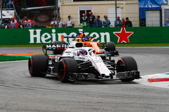 Sergey Sirotkin, Williams FW41, leads Fernando Alonso, McLaren MCL33