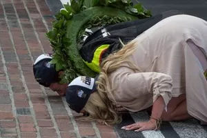 Simon Pagenaud, Team Penske Chevrolet, and his fiancee Hailey McDermott kiss the bricks after his win