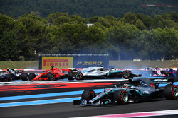 Lewis Hamilton, Mercedes-AMG F1 W09 leads at the start of the race as Sebastian Vettel, Ferrari SF71H hits Valtteri Bottas, Mercedes-AMG F1 W09