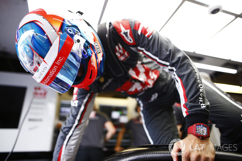 Romain Grosjean, Haas F1 Team, enters his cockpit.