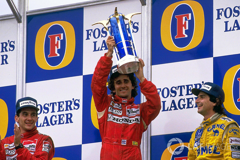 Podium: race winner Alain Prost, McLaren, second place Ayrton Senna, McLaren, third place Nelson Piquet, Lotus