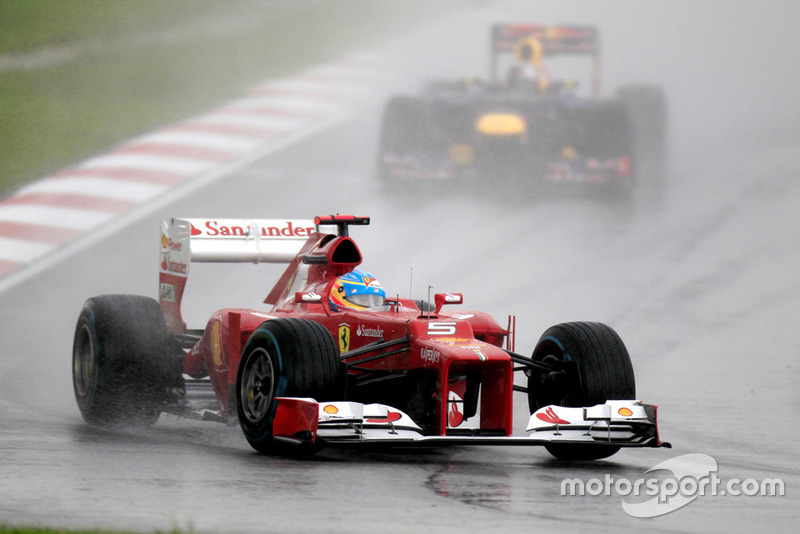 Fernando Alonso, Ferrari F2012, leads Sebastian Vettel, Red Bull RB8 Renault