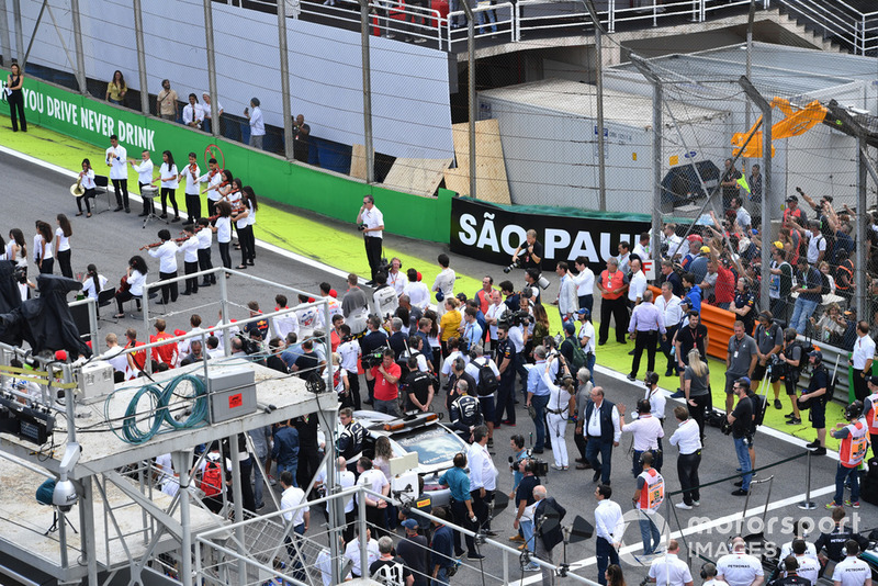 Drivers during the National Anthem on the grid 