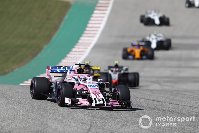 Sergio Perez, Racing Point Force India VJM11, leads Carlos Sainz Jr., Renault Sport F1 Team R.S. 18, Kevin Magnussen, Haas F1 Team VF-18, and the remainder of the field on the formation lap