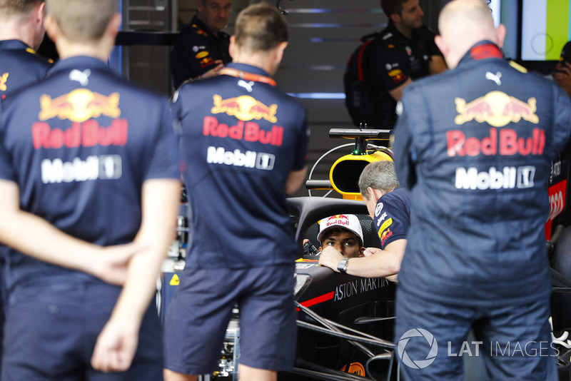 Pierre Gasly, Toro Rosso, sits in a Red Bull Racing RB14