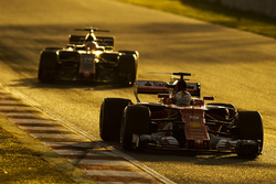 Sebastian Vettel, Ferrari SF70H; Kevin Magnussen, Haas F1 Team VF-17