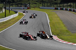 Max Verstappen, Red Bull Racing RB13, passes Sebastian Vettel, Ferrari SF70H, at the start of the ra