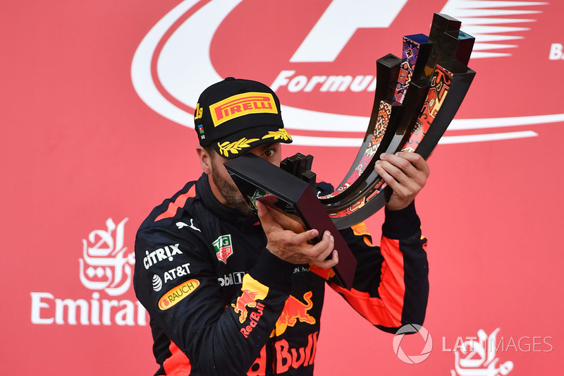 Race winner Daniel Ricciardo, Red Bull Racing celebrates on the podium, the trophy