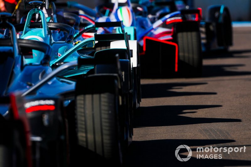 FE cars in the pit pane.