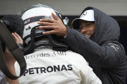 Lewis Hamilton, Mercedes AMG F1, congratulates team mate Valtteri Bottas, Mercedes AMG F1, on securi
