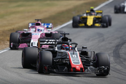 Romain Grosjean, Haas F1 Team VF-18,leads Sergio Perez, Force India VJM11, and Carlos Sainz Jr., Renault Sport F1 Team R.S. 18