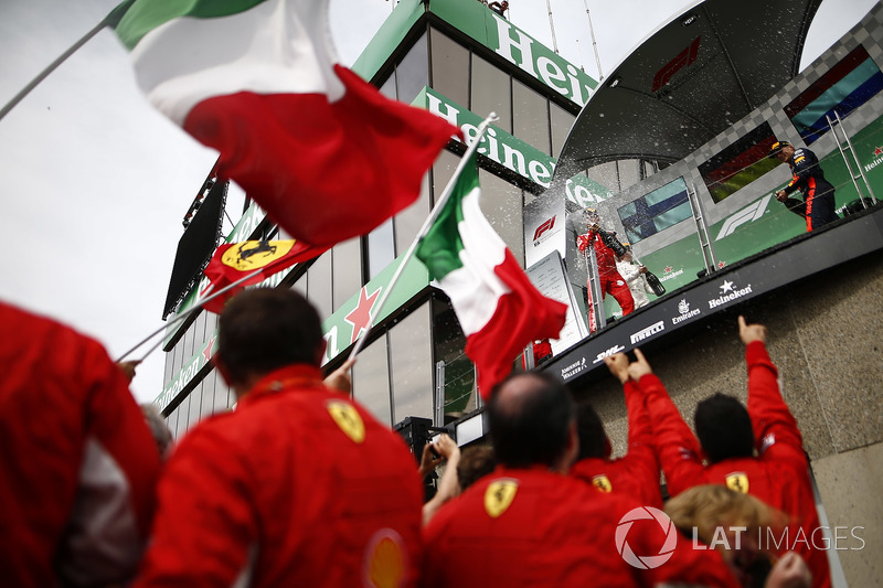 Sebastian Vettel, Ferrari, 1st position, and Max Verstappen, Red Bull Racing, 3rd position, spray Ch