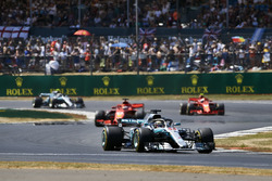 Lewis Hamilton, Mercedes AMG F1 W09, leads Sebastian Vettel, Ferrari SF71H, Kimi Raikkonen, Ferrari SF71H, and Valtteri Bottas, Mercedes AMG F1 W09