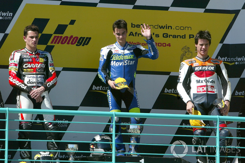 Podium : le deuxième Randy De Puniet, le vainqueur Dani Pedrosa, le troisième Sebastián Porto