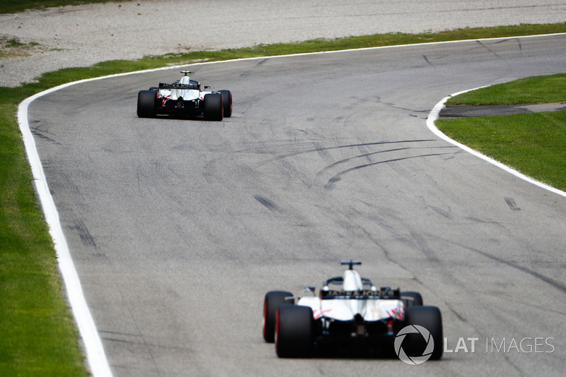 Kevin Magnussen, Haas F1 Team VF-18, leads Romain Grosjean, Haas F1 Team VF-18