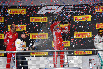 Max Verstappen, Red Bull Racing, Kimi Raikkonen, Ferrari and Lewis Hamilton, Mercedes AMG F1 celebrate on the podium with the champagne