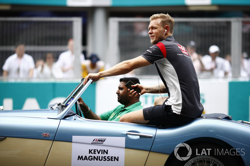 Kevin Magnussen, Haas F1 Team, rides in an Austin Healey, on the drivers parade