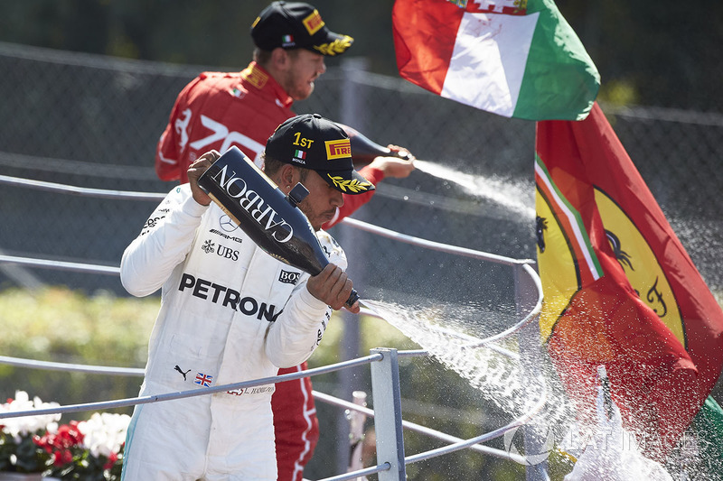 Race winner Third place Lewis Hamilton, Mercedes AMG F1 Sebastian Vettel, Ferrari, pour Champagne from the podium