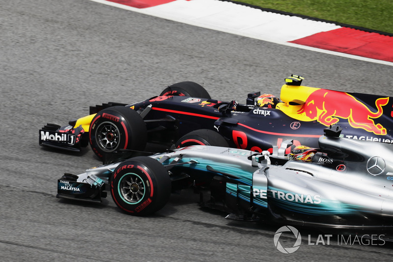 Max Verstappen, Red Bull Racing RB13, passes Lewis Hamilton, Mercedes F1 W08