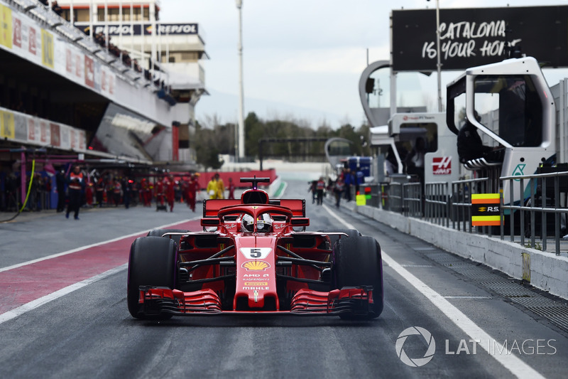 Jo Bauer, FIA Technical Delegate watches Sebastian Vettel, Ferrari SF71H in pit lane