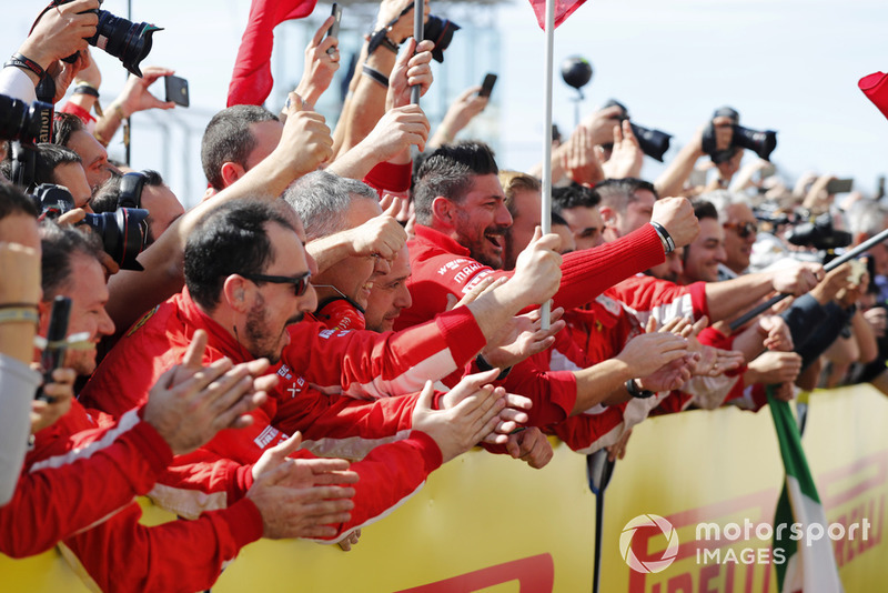 The Ferrari team cheer as Kimi Raikkonen, Ferrari SF71H, 1st position, arrives in Parc Ferme