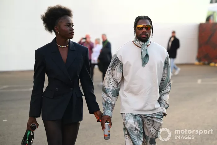 Noah Lyles and his partner Junelle Bromfield arrive at the track