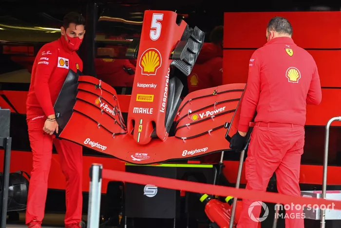 Ferrari mechanics with Ferrari SF1000 nose cone