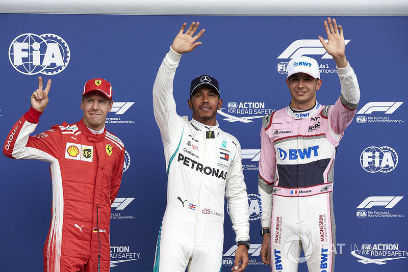 Top three Qualifiers Sebastian Vettel, Ferrari, pole man Lewis Hamilton, Mercedes AMG F1, and Esteban Ocon, Racing Point Force India