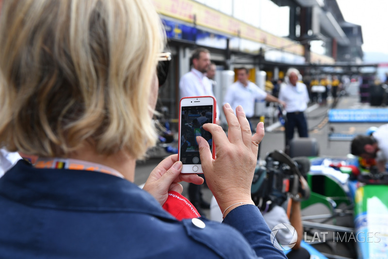 Sabine Kehm, takes a photo of Mick Schumacher, Benetton B194