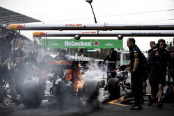 The brakes of Max Verstappen, Red Bull Racing RB12, catch fire in the pits