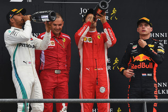 Lewis Hamilton, Mercedes AMG F1, David Sanchez, Ferrari, Sebastian Vettel, Ferrari and Max Verstappen, Red Bull Racing celebrate on the podium with the champagne