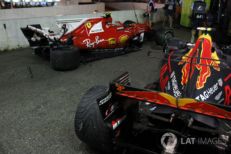 The damaged cars of Kimi Raikkonen, Ferrari SF70H and Max Verstappen, Red Bull Racing RB13 after colliding at the start of the race