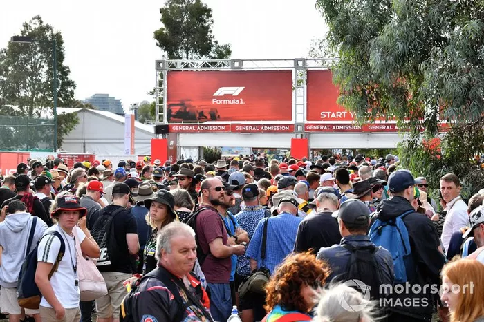Fans queue as the gates are delayed in opening