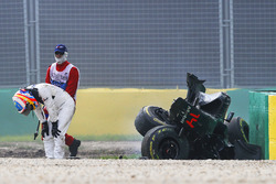 Fernando Alonso, McLaren MP4-31 exits his car after a huge crash