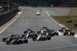 Kevin Magnussen, Haas F1 Team VF-18, leads Romain Grosjean, Haas F1 Team VF-18 and Charles Leclerc, Sauber C37, a the start, as behind Sergio Perez, Force India VJM11, locks-up behind Nico Hulkenberg, Renault Sport F1 Team R.S. 18