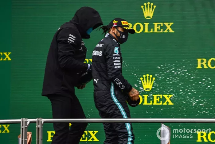 Toto Wolff, Executive Director (Business), Mercedes AMG, Lewis Hamilton, Mercedes-AMG F1, 1st position, and Sebastian Vettel, Ferrari, 3rd position, celebrate on the podium