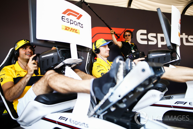 Carlos Sainz Jr., Renault Sport F1 Team, and Nico Hulkenberg, Renault Sport F1 Team, try out the F1 eSports