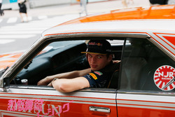 Daniel Ricciardo and Max Verstappen, Red Bull Racing drive around Tokyo in a Bosozuko Car