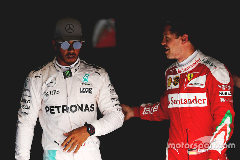 (L to R): Pole sitter Lewis Hamilton, Mercedes AMG F1 with third placed Sebastian Vettel, Ferrari in parc ferme