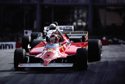 With 4 laps to go Gilles Villeneuve takes the lead from Alan Jones' Williams