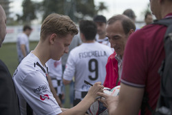 Mick Schumacher, signs an autograph