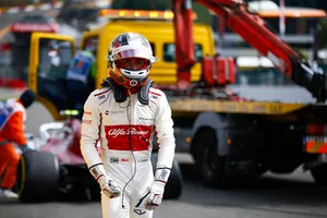 Charles Leclerc, Sauber C37, retires on the opening lap, after contact from Fernando Alonso, McLaren