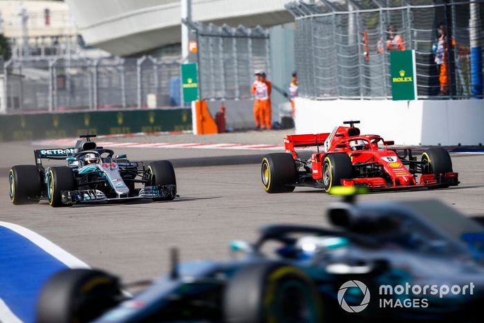 Sebastian Vettel, Ferrari SF71H, leads Lewis Hamilton, Mercedes AMG F1 W09