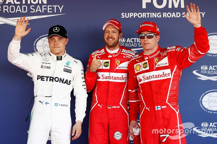 Ganador de la pole Sebastian Vettel, Ferrari, segundo puesto Kimi Raikkonen, Ferrari, tercer puesto 