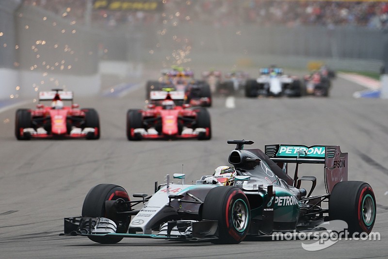 Lewis Hamilton, Mercedes AMG F1 W06 leads the battling Sebastian Vettel, Ferrari SF15-T and Kimi Raikkonen, Ferrari SF15-T